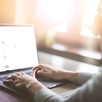 person sitting in front of a computer